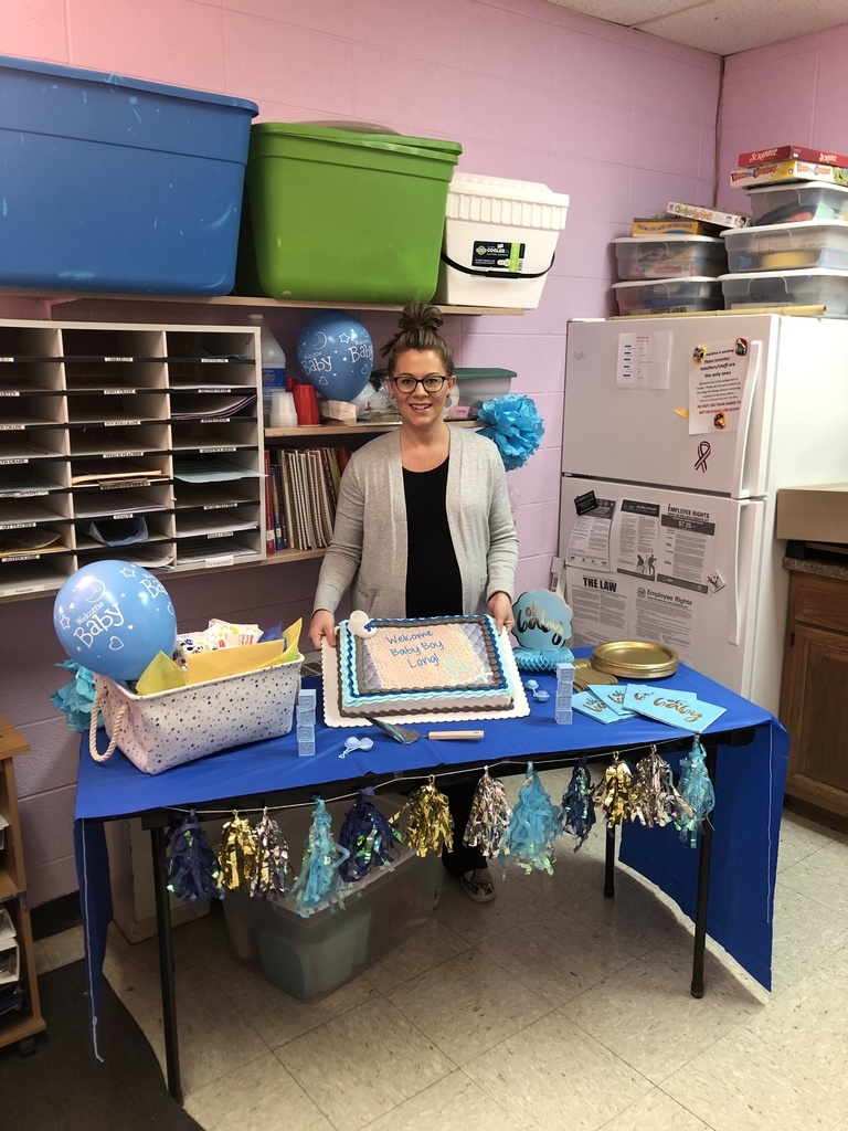 Mrs. Sonja Long with her cake and gifts for Baby Wade Roger 